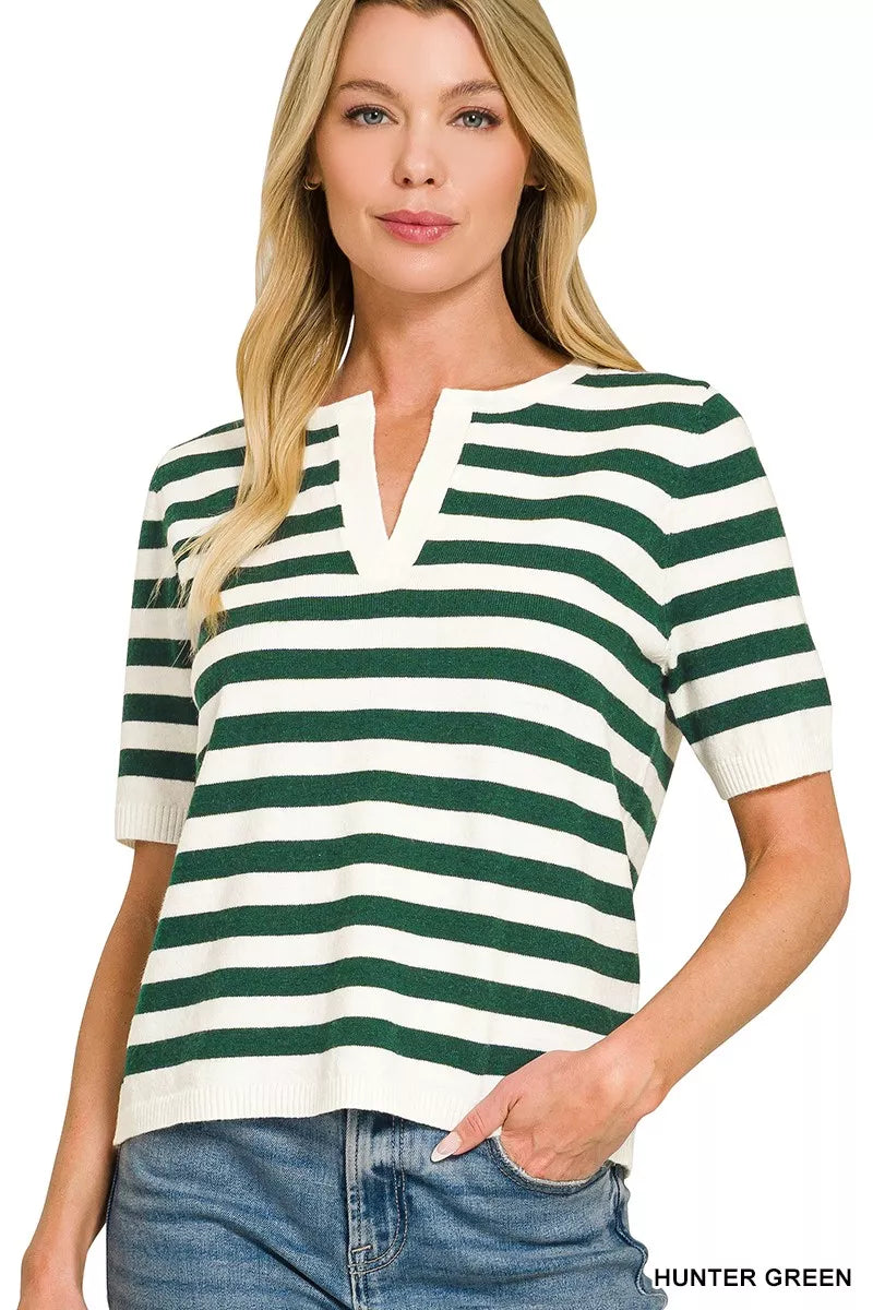 Woman wearing a green and white striped shirt with text 'HUNTER GREEN' on a white background