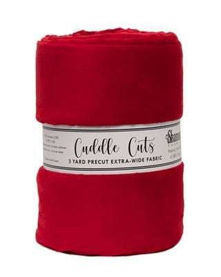 A folded red fleece blanket with a white paper label band reading 'Cuddle Cuts' and '3 Yard Precut Extra-Wide Fabric' on a plain white background.