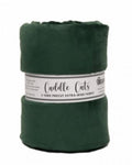 A dark green roll of Cuddle Cuts precut fabric, wrapped in a white paper band showing the brand name 'Shamrock Fabrics'.