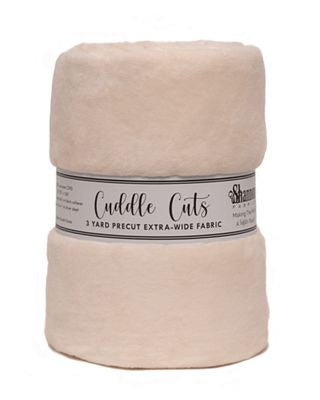 A stack of two folded cream-colored fabric yardage rolls with a paper band label reading 'Cuddle Cuts' and '3 YARD PRECUT EXTRA-WIDE FABRIC' on a white background.