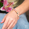 Peruvian pink opal bracelet worn on the wrist