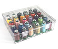 A clear plastic storage organizer filled with multiple spools of thread in assorted colors, photographed on a white background.