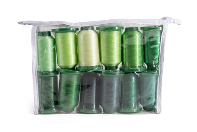 A clear plastic zippered pouch containing multiple spools of thread in various shades of green, including light lime, olive, forest, and dark charcoal green, set against a plain white background.