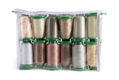 A clear zippered plastic storage bag containing 12 spools of thread arranged in two rows of six. The threads are in various colors including beige, brown, silver, and gold, each spool fitted with a green plastic cap.