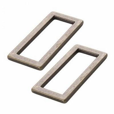 Two rectangular metal washers on a white background