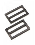 Two black metal rectangular buckle plates with three slots, shown on a plain white background.