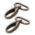 Two bronze metal clamps on a white background