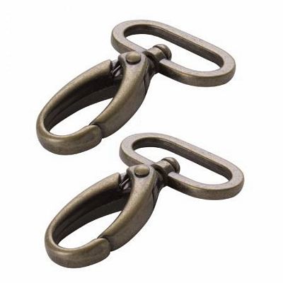 Two bronze metal clamps on a white background