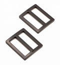 Two black metal rectangular slider rings with a matte finish, displayed on a clean white background.