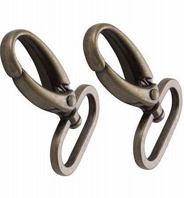 Two antique bronze metal lobster claw hooks with attached split rings, shown on a plain white background.
