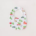 Baby bib with farm-themed pattern on a white background