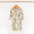 Baby onesie with horse pattern on a hanger against a white background