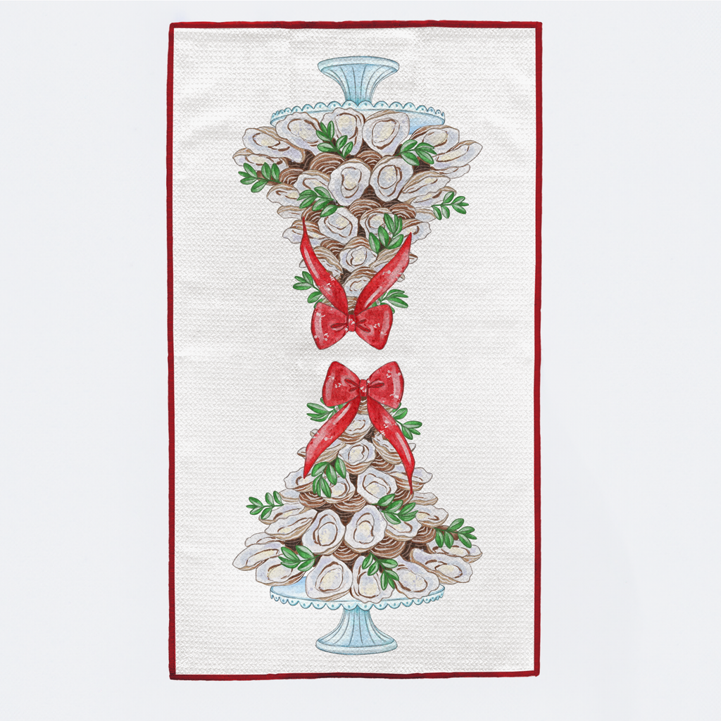 Decorative towel with oyster design and red bows on a white background