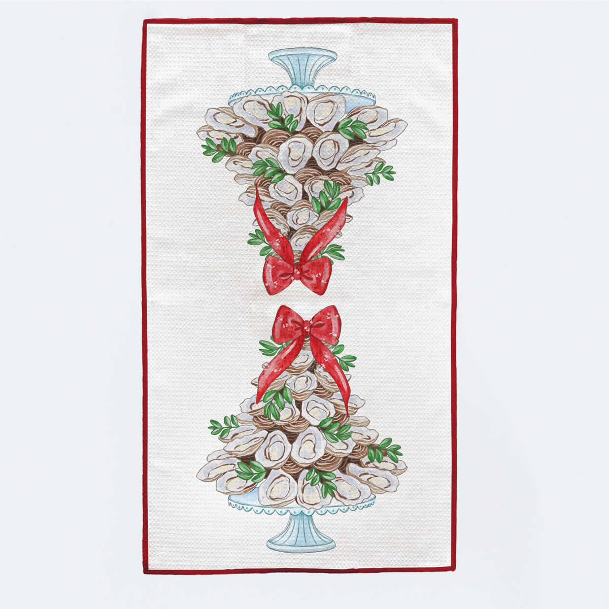Decorative towel with oyster design and red bows on a white background