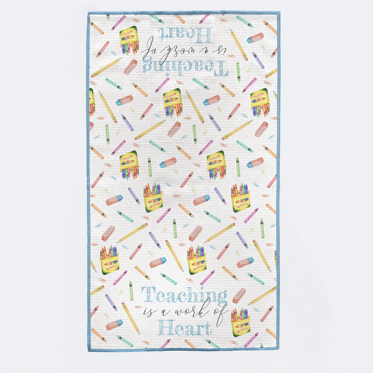 Patterned towel with colorful school supplies and text on a white background