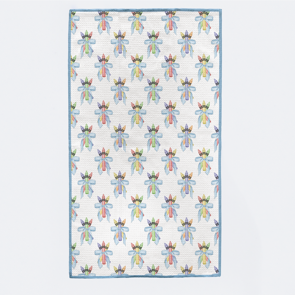 Patterned quilt with colorful designs on a light blue background