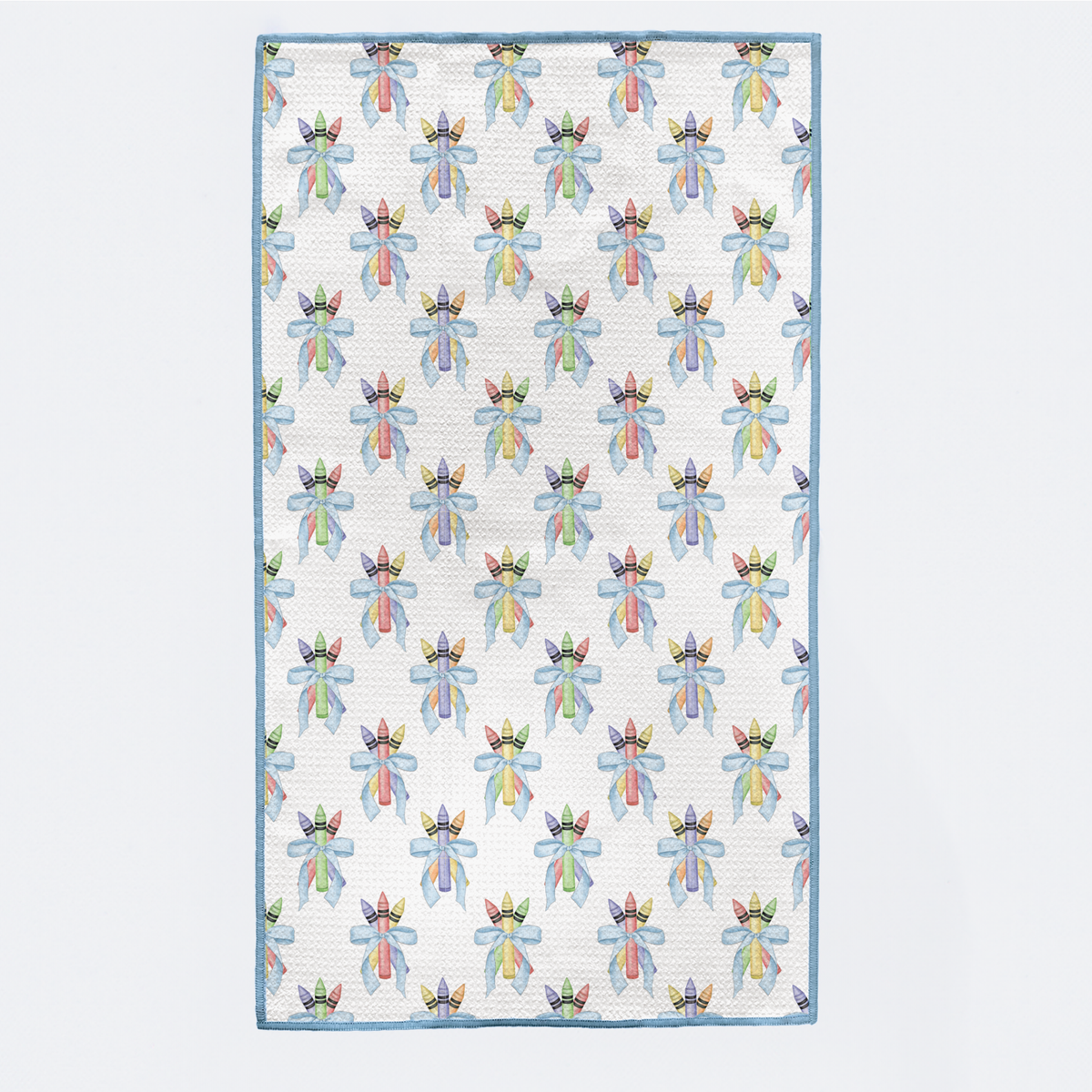 Patterned quilt with colorful designs on a light blue background