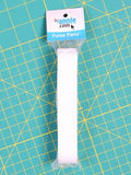 White strap packaging on a teal cutting mat with 'By Annie' label