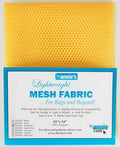 Yellow mesh fabric with blue and white label on a yellow background