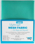 A package of Annie's Lightweight Mesh Fabric in teal green, showing a close-up of the mesh material above a blue and white product label.