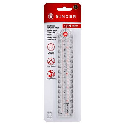 Singer 12-inch steel rule in retail blister packaging, featuring a clear metal ruler with engraved markings and a red header card with the Singer logo.
