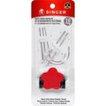 Singer heavy fabric repair kit packaging with needles and a flower-shaped tool on a white background