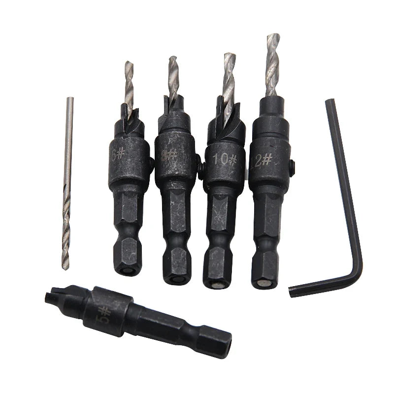 Set of drill bits with a hex bit and wrench on a white background