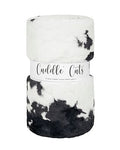 Black and white patterned blanket with 'Cuddle Cats' label on a white background