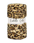 Leopard print plush fabric with 'Cuddle Cuts' label on a white background