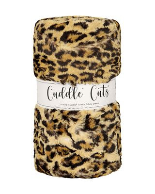 Leopard print plush fabric with 'Cuddle Cuts' label on a white background