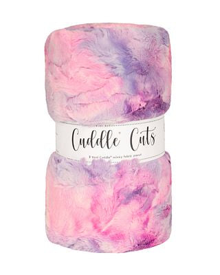 A folded plush fabric with a pink and purple watercolor pattern, wrapped in a white paper band labeled 'Cuddle Cats'.