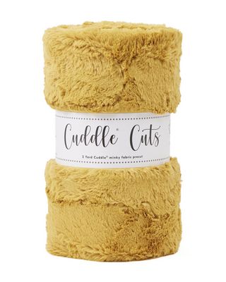 Roll of yellow  plush fabric with 'Cuddle Cuts' label on a white background