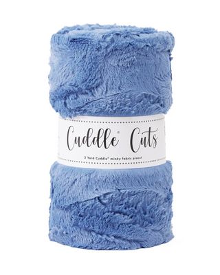 Blue plush fabric roll with 'Cuddle Cuts' label on a white background