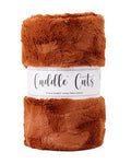 Brown plush fabric roll with 'Cuddle Cuts' label on a white background