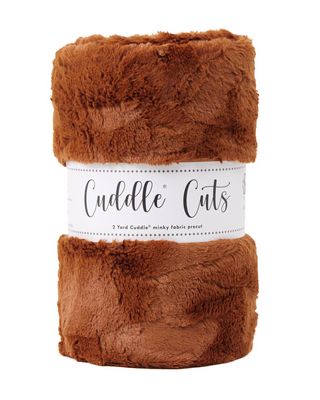 Brown plush fabric roll with 'Cuddle Cuts' label on a white background