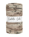Cozy Cuddle Cuts plush off-white, tan, and brown fabric with label on a white background