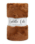 Brown plush fabric roll with 'Cuddle Cuts' label on a white background
