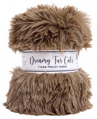 A roll of Dreamy Fur Cuts faux fur fabric in a warm brown shade, wrapped with a white paper label that reads 'Dreamy Fur Cuts 1 Yard Precut Fabric'.