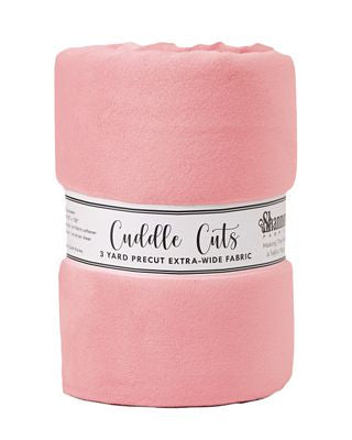 A roll of dusty pink fleece fabric with a paper label reading 'Cuddle Cuts' and '3 YARD PRECUT EXTRA-WIDE FABRIC' on a white background.