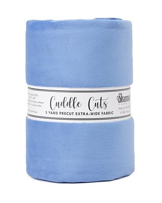 A roll of light blue precut fabric wrapped with a white paper label that reads 'Cuddle Cats' and '3 YARD PRECUT EXTRA-WIDE FABRIC'.