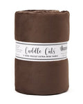 Brown fabric roll with a label on a white background