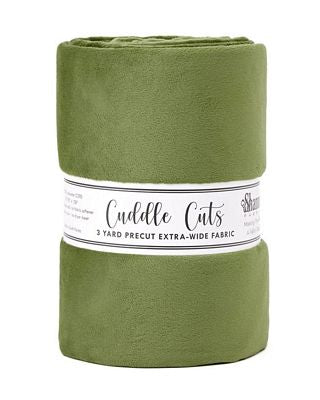 An olive green fleece blanket rolled into a cylinder with a white paper label band, shown against a plain white background.