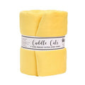 A roll of yellow Cuddle Cats brand precut extra-wide fabric, wrapped in a white paper band label, on a solid white background.