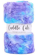 A roll of fuzzy plush fabric wrapped in a white paper band labeled 'Cuddle Cuts'. The yarn has a marbled pattern of purple, blue, and light teal.