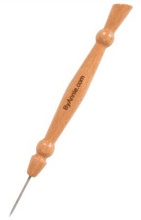 A wooden jewelry tool with a pointed metal tip, featuring a light brown wood handle with decorative knobs and the text 'ByAnnie.com' printed on it, set against a plain white background.