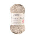 Ball of beige yarn with a label on a white background