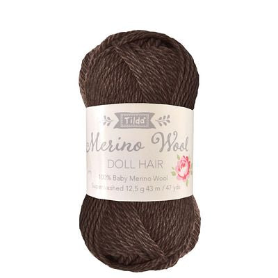 Brown yarn ball with a label on a white background