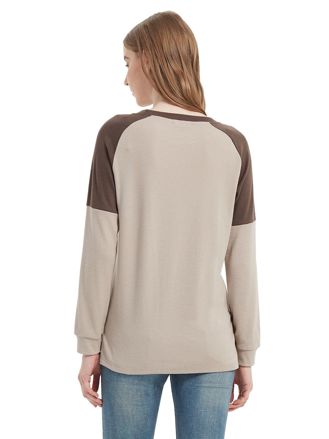 Woman wearing a beige and brown long-sleeve shirt on a white background
