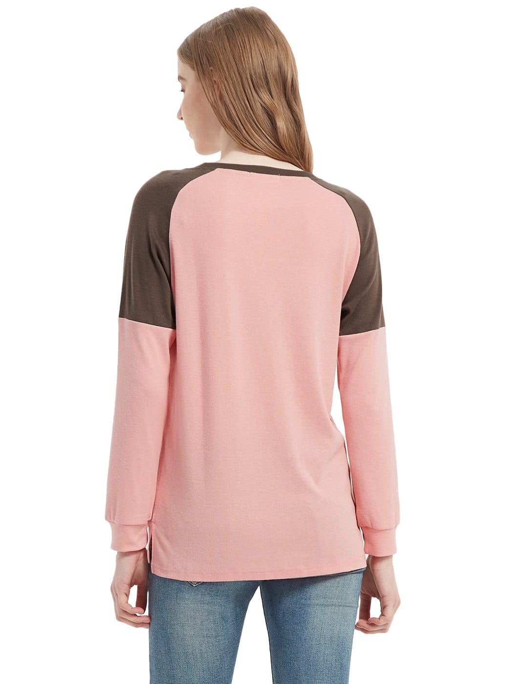 Woman wearing a pink and brown long-sleeve shirt on a white background