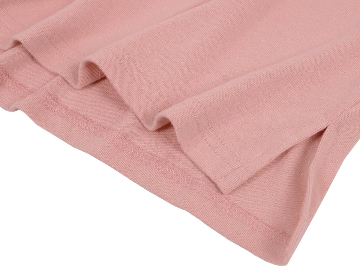 Close-up of pink fabric with a white background